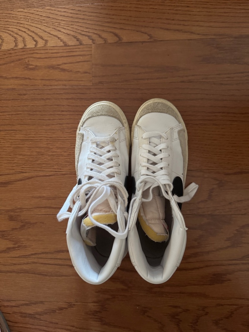 Nike White High-Top Sneakers with Black Swoosh and Cream Accents